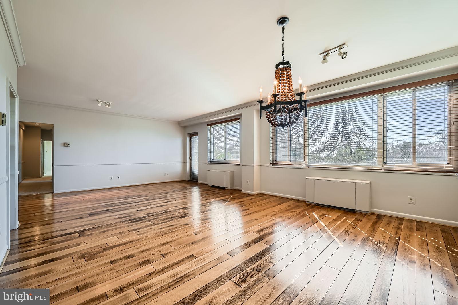11 Slade Avenue, Unit 509 Baltimore, MD 21208 - Photo 8 of 30 a view of empty room with wooden floor and fan