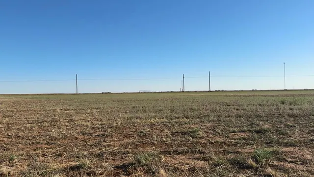 a view of an ocean beach and mountain