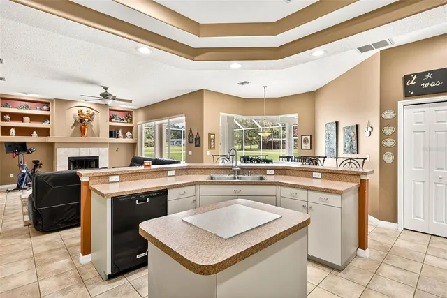 a living room with furniture fireplace and flat screen tv
