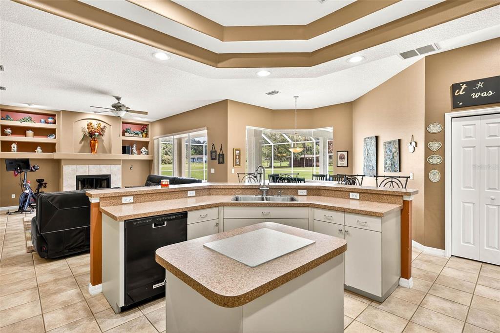 8518 West Knights Griffin Road Plant City, FL 33565 - Photo 15 of 74 a kitchen with stainless steel appliances granite countertop a stove and a sink