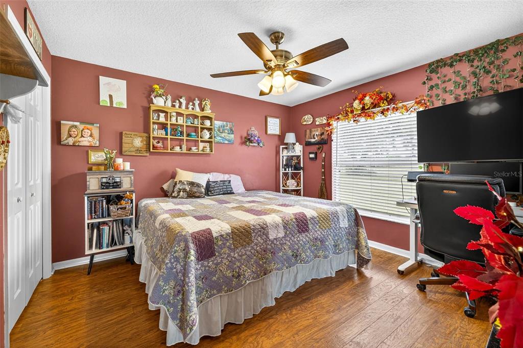 8518 West Knights Griffin Road Plant City, FL 33565 - Photo 32 of 74 a bedroom with a bed and a flat screen tv