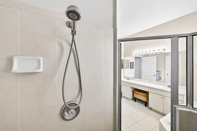 a view of a green field with an trees