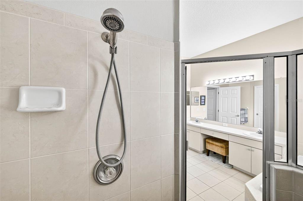 8518 West Knights Griffin Road Plant City, FL 33565 - Photo 42 of 74 a bathroom with a sink and mirror