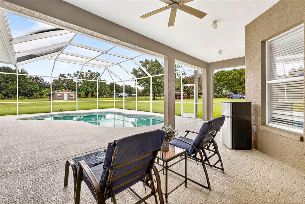 8518 West Knights Griffin Road Plant City, FL 33565 - Photo 46 of 74 a view of a room with furniture and wooden floor
