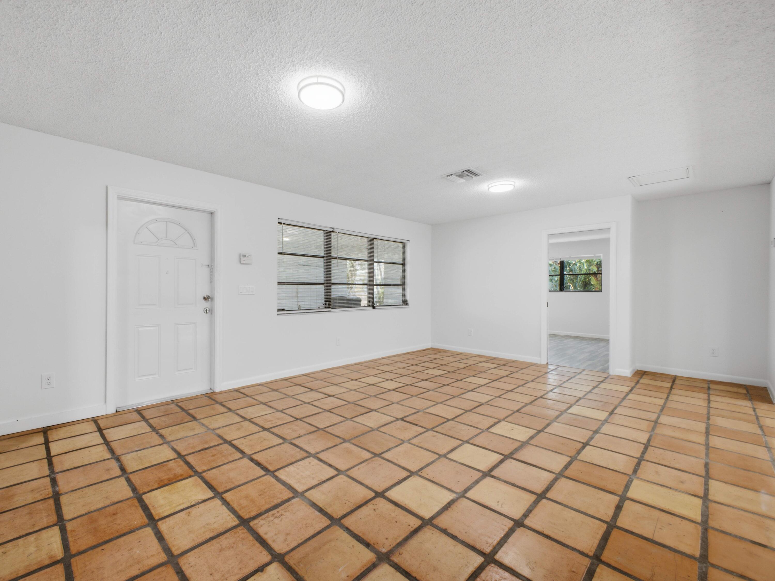 6700 Forest Court West Palm Beach, FL 33405 - Photo 19 of 45 Dining to Primary Bedroom