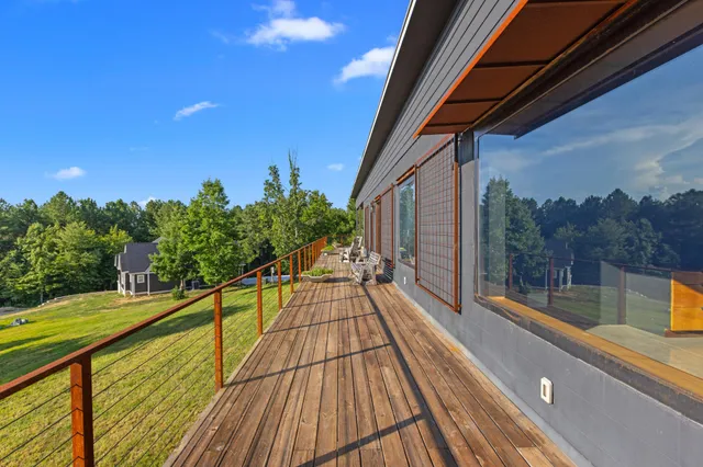 a view of kitchen with furniture and refrigerator