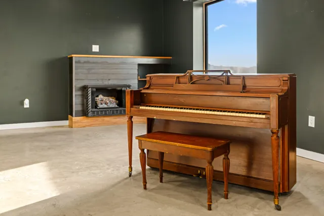 a view of kitchen with refrigerator and window