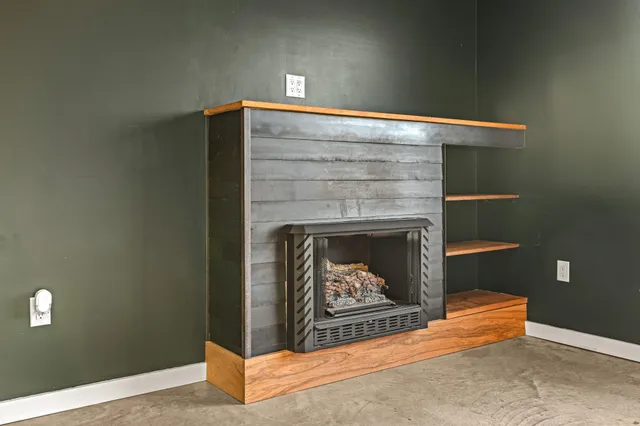 a view of a kitchen with a sink and a window