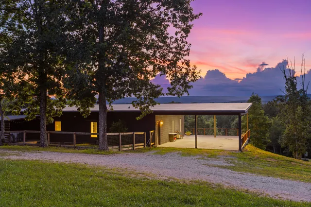 a view of a balcony with a yard