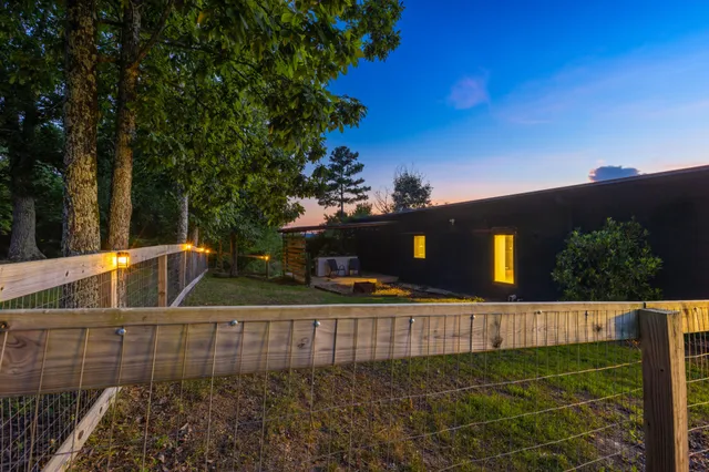 a view of a backyard with a garden and plants