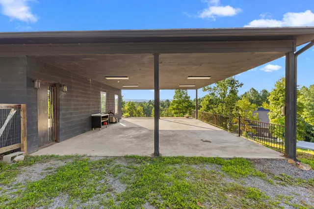 a view of a table and chairs in the back yard