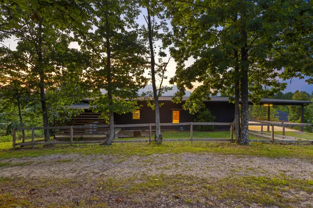 a view of a yard with a house in the background