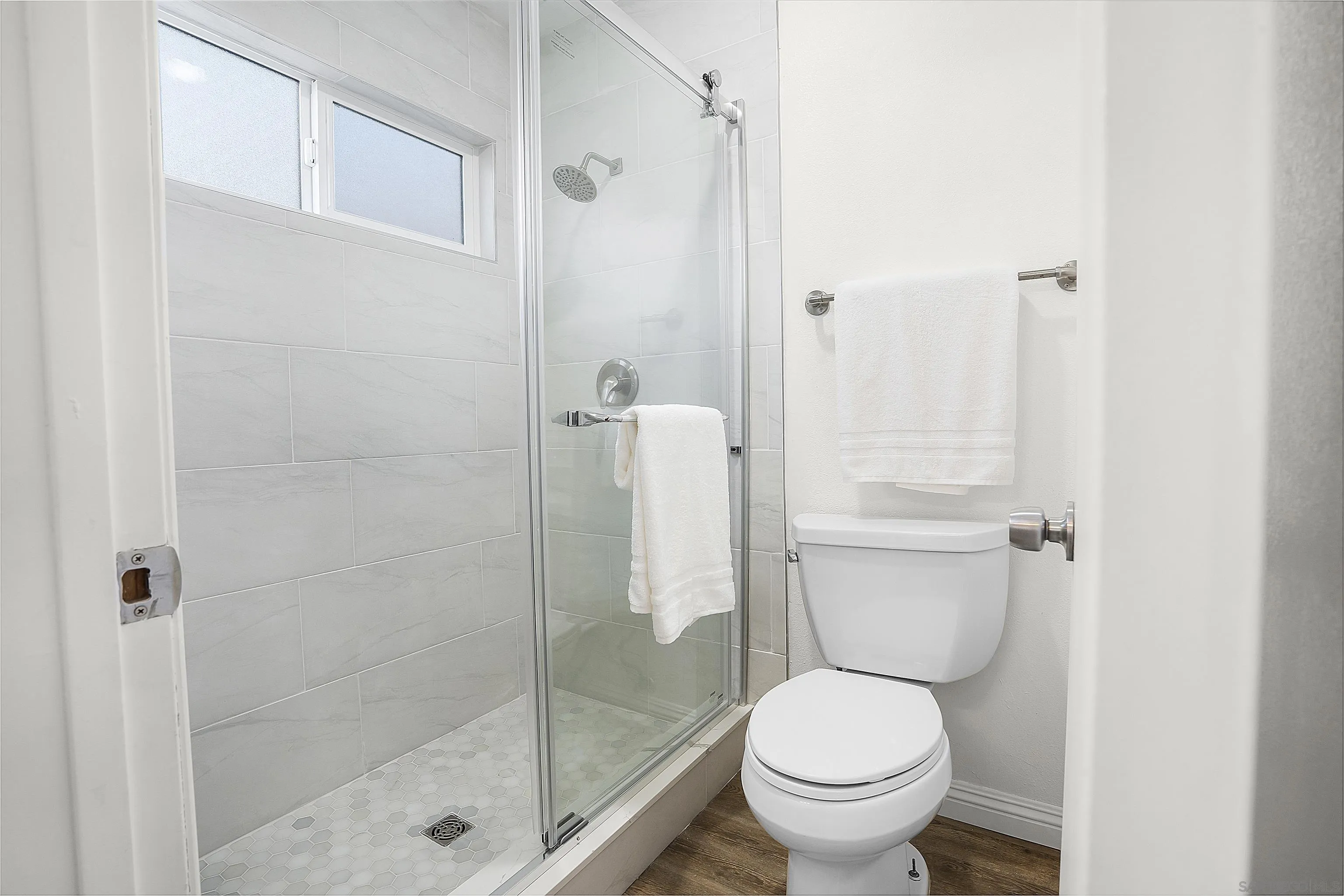 1138 Sidonia Street Encinitas, CA 92024 - Photo 12 of 17 a bathroom with a toilet and a shower