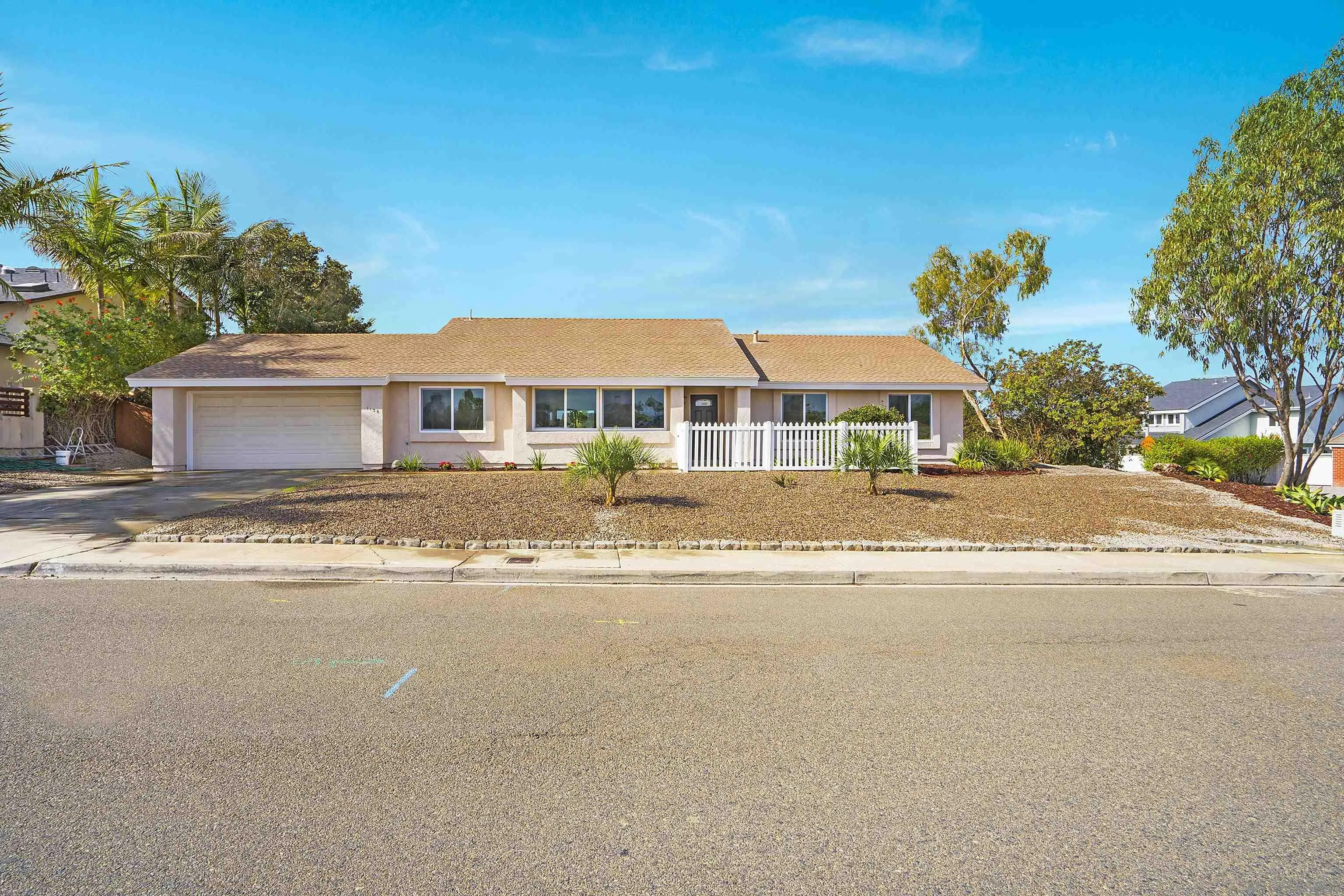 1138 Sidonia Street Encinitas, CA 92024 - Photo 2 of 17 front view of a house with a yard