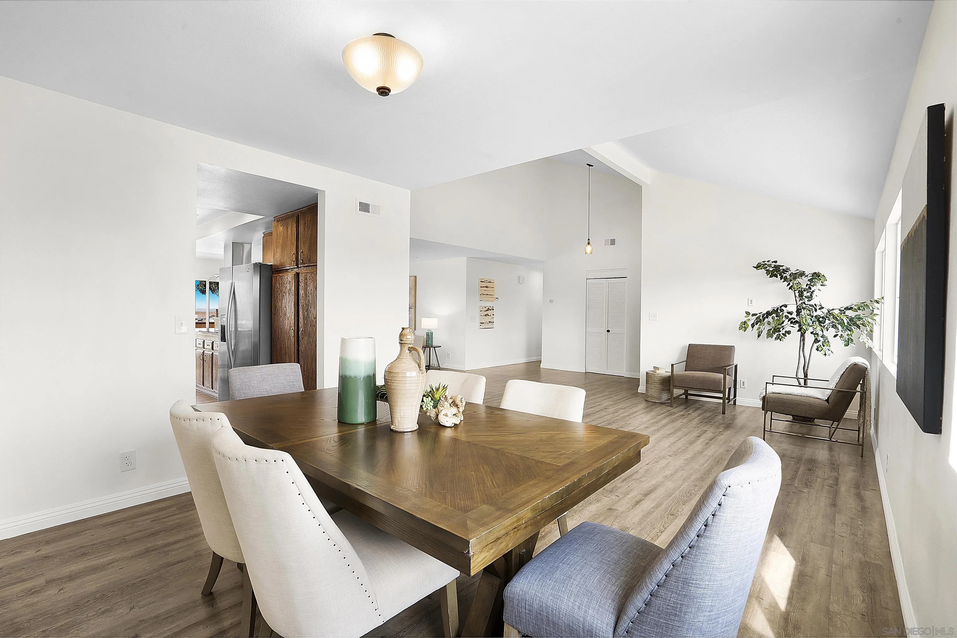 1138 Sidonia Street Encinitas, CA 92024 - Photo 7 of 17 a view of a dining room with furniture and wooden floor