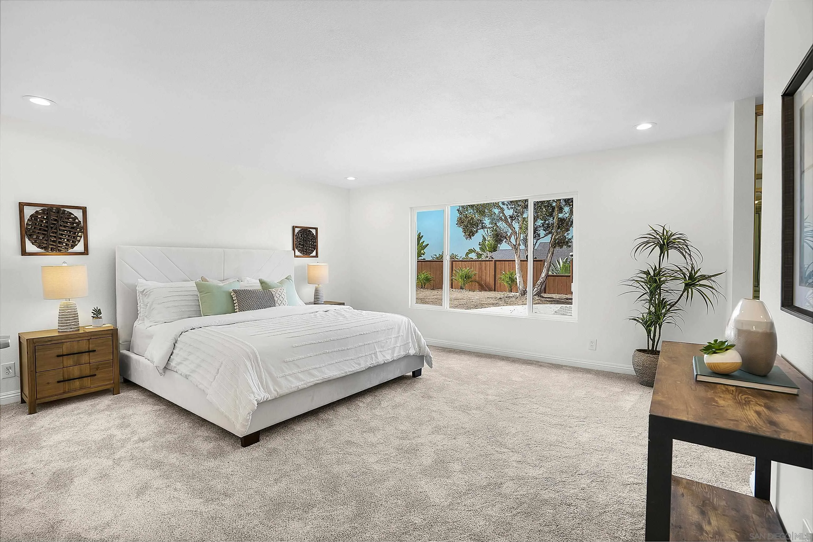 1138 Sidonia Street Encinitas, CA 92024 - Photo 9 of 17 a spacious bedroom with a bed and a window