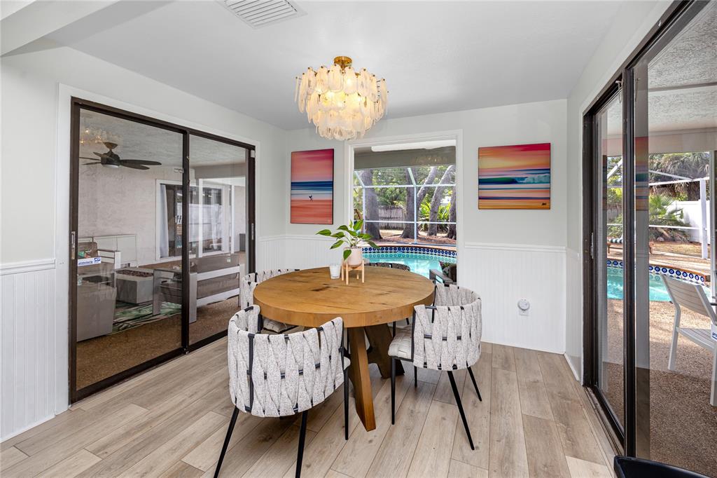 27 Summit Lane Safety Harbor, FL 34695 - Photo 11 of 48 a view of a dining room with furniture and wooden floor