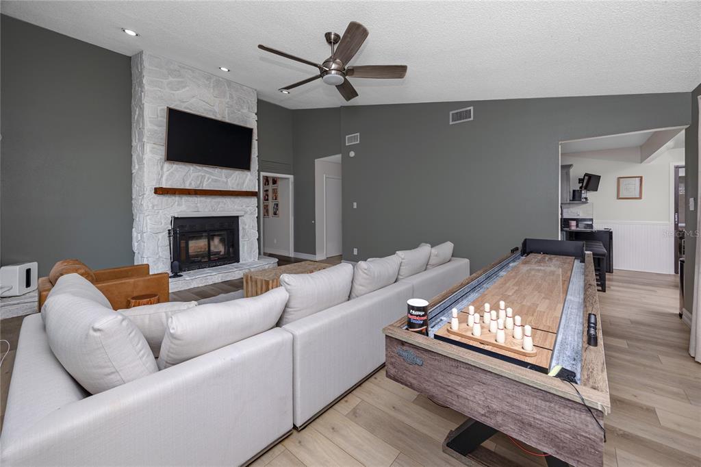 27 Summit Lane Safety Harbor, FL 34695 - Photo 13 of 48 a living room with furniture and a fireplace