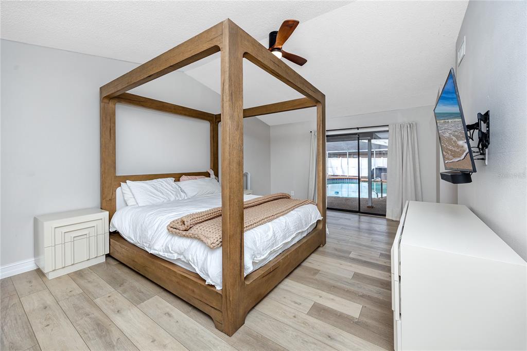 27 Summit Lane Safety Harbor, FL 34695 - Photo 14 of 48 a bedroom with a bed and window