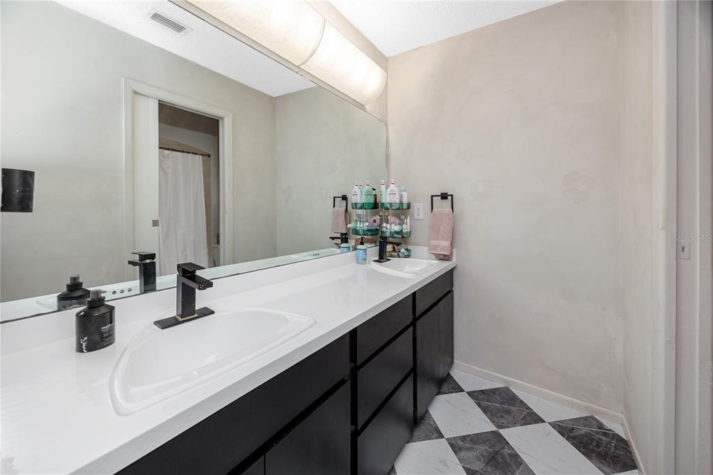 27 Summit Lane Safety Harbor, FL 34695 - Photo 17 of 48 a bathroom with a sink and a mirror