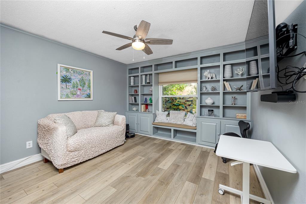 27 Summit Lane Safety Harbor, FL 34695 - Photo 22 of 48 a living room with furniture and a window
