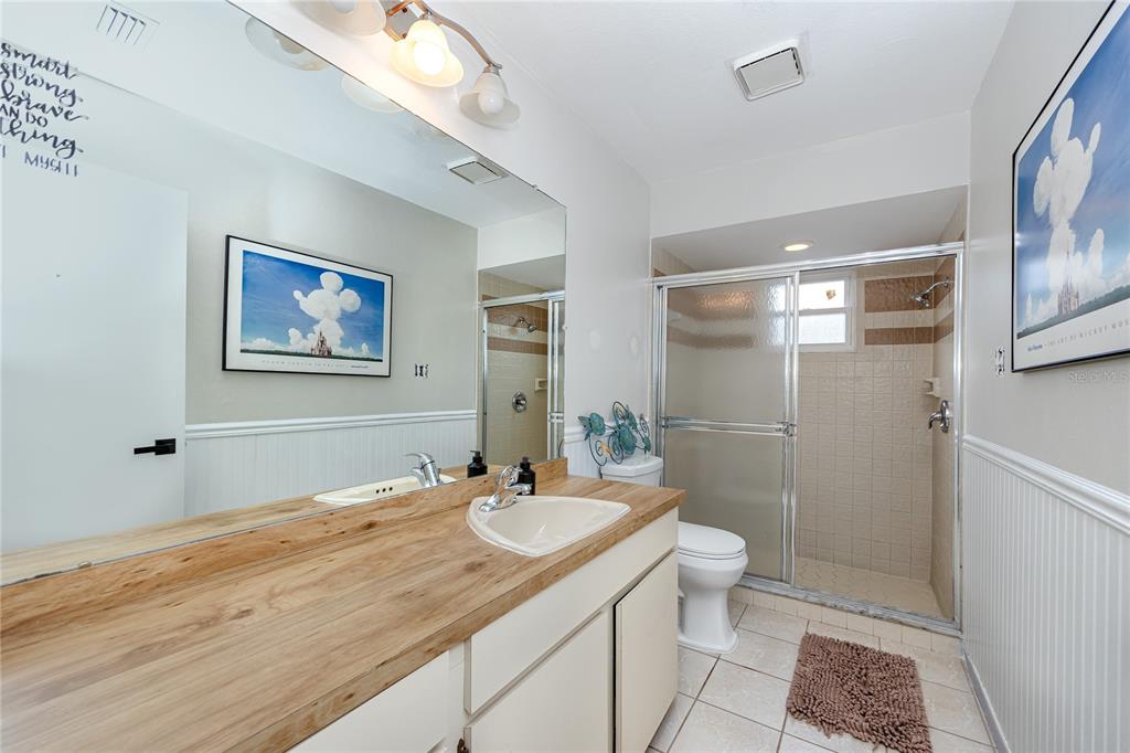 27 Summit Lane Safety Harbor, FL 34695 - Photo 26 of 48 a bathroom with a sink a toilet a shower and a mirror