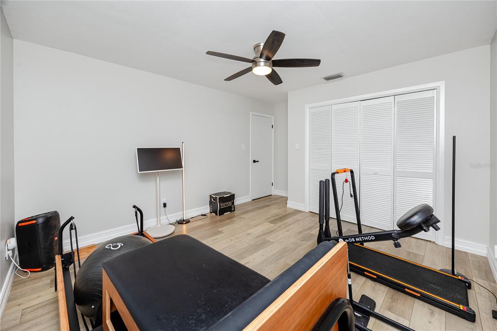 27 Summit Lane Safety Harbor, FL 34695 - Photo 28 of 48 a room with furniture and a ceiling fan