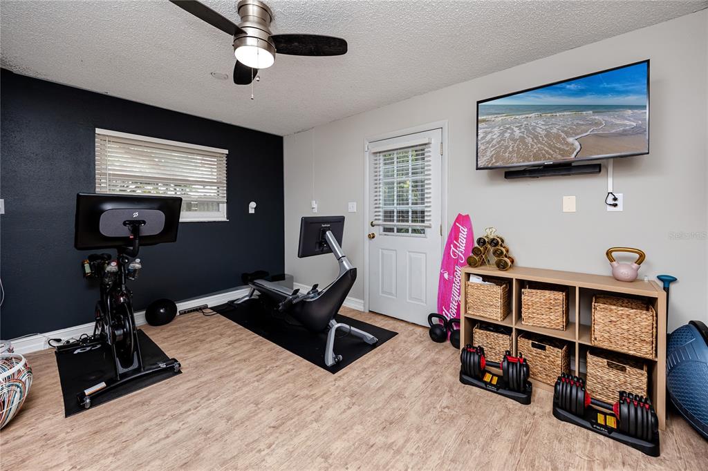 27 Summit Lane Safety Harbor, FL 34695 - Photo 35 of 48 a room with gym equipment and a window