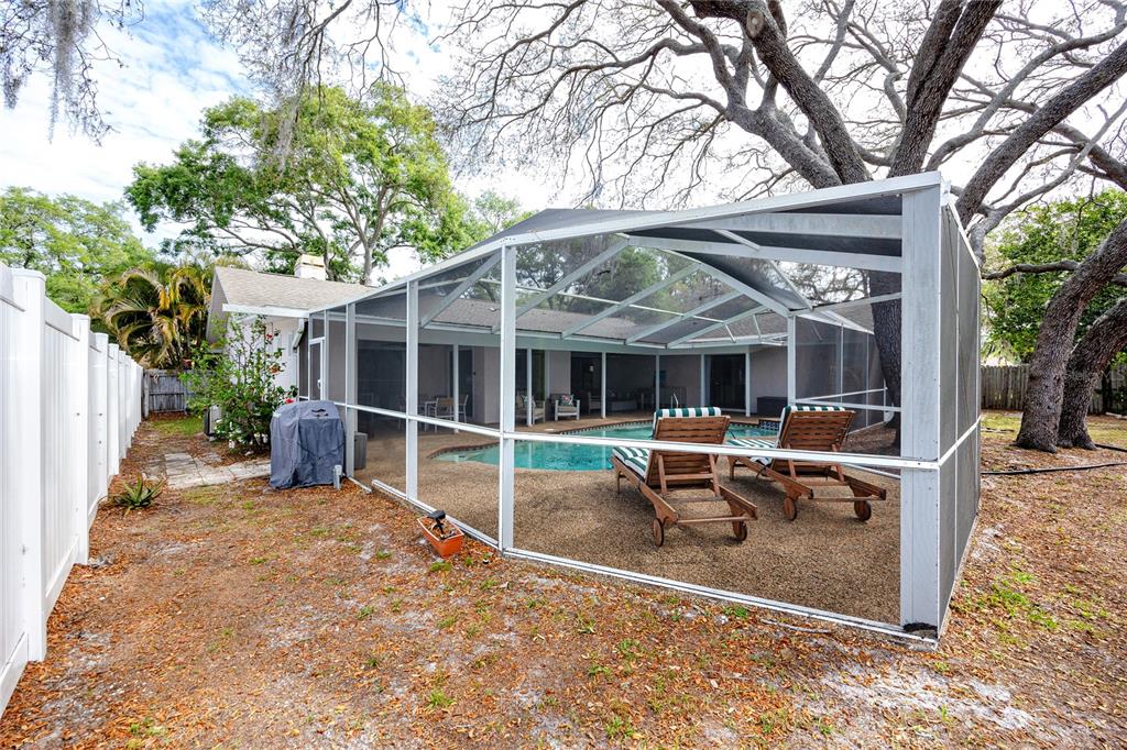 27 Summit Lane Safety Harbor, FL 34695 - Photo 40 of 48 a view of a house with backyard sitting area and porch