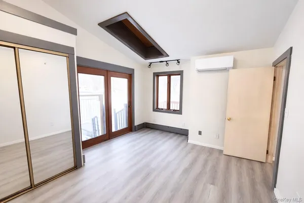 a view of an empty room with glass door