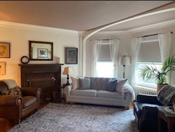 802 State Road Plymouth, MA 02360 - Photo 14 of 42 a living room with furniture and a fireplace