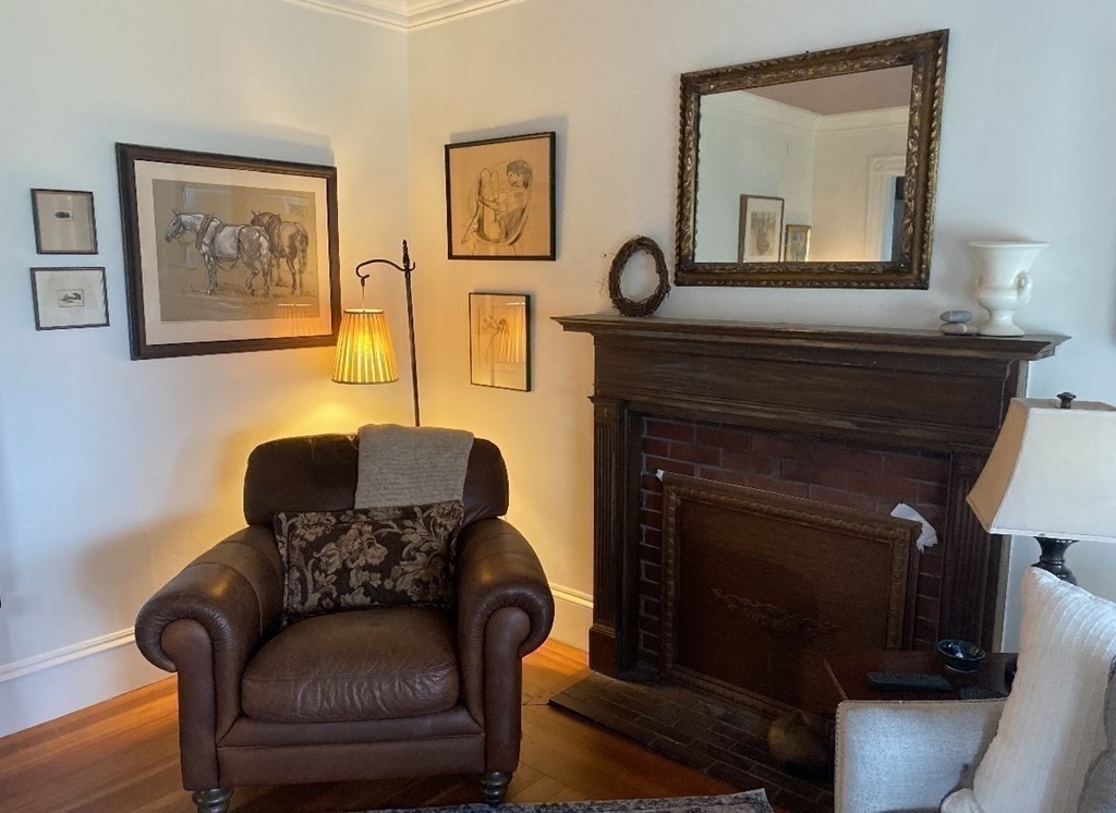 802 State Road Plymouth, MA 02360 - Photo 15 of 42 a living room with furniture and a fireplace
