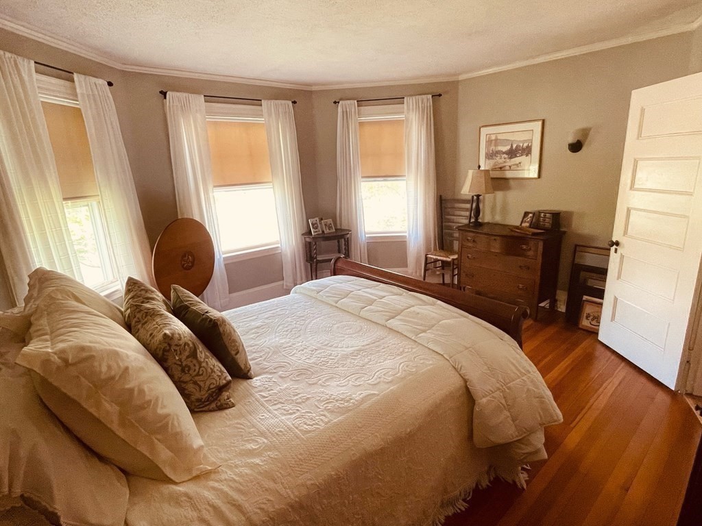 802 State Road Plymouth, MA 02360 - Photo 21 of 42 a bedroom with a bed and wooden floor
