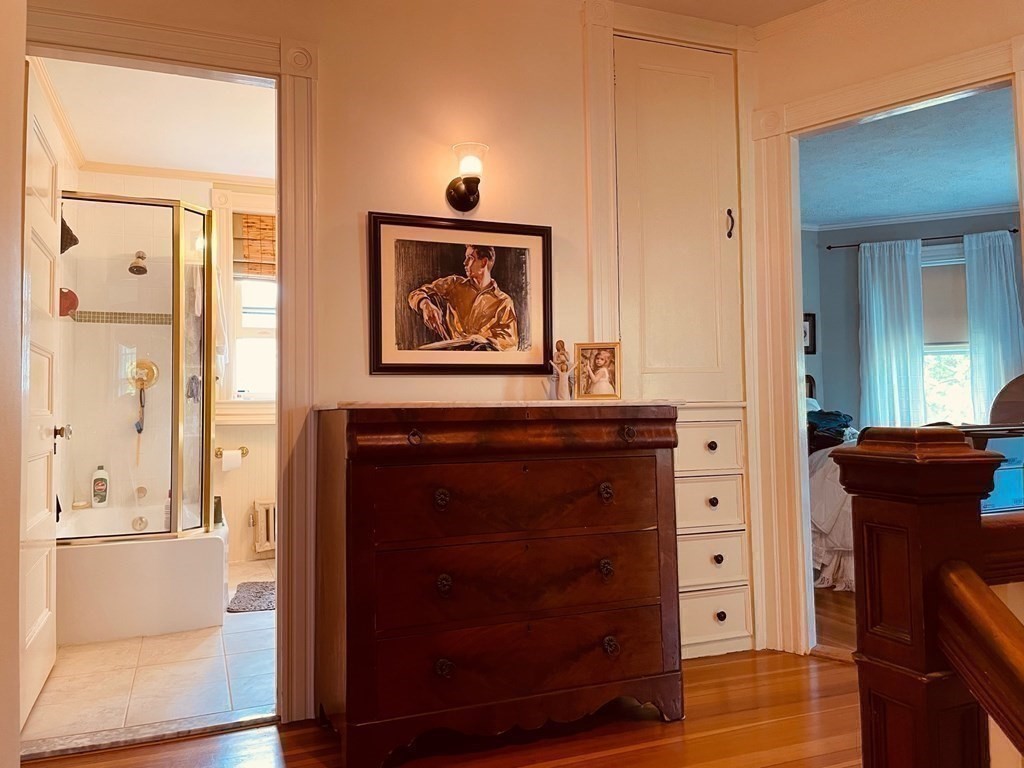 802 State Road Plymouth, MA 02360 - Photo 25 of 42 a view of a hallway with wooden floor and cabinet