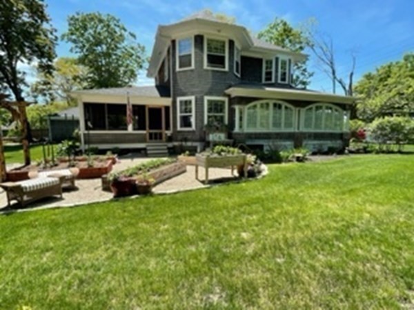 802 State Road Plymouth, MA 02360 - Photo 27 of 42 a view of a house with a yard and sitting area