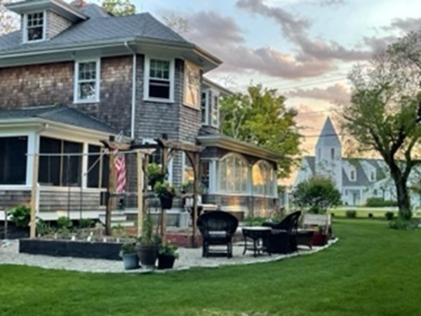 802 State Road Plymouth, MA 02360 - Photo 29 of 42 a front view of a house with a garden and tree