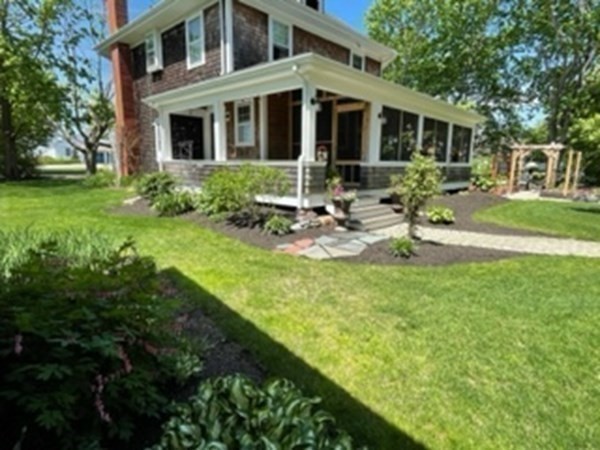 802 State Road Plymouth, MA 02360 - Photo 30 of 42 a view of a house with backyard sitting area and garden