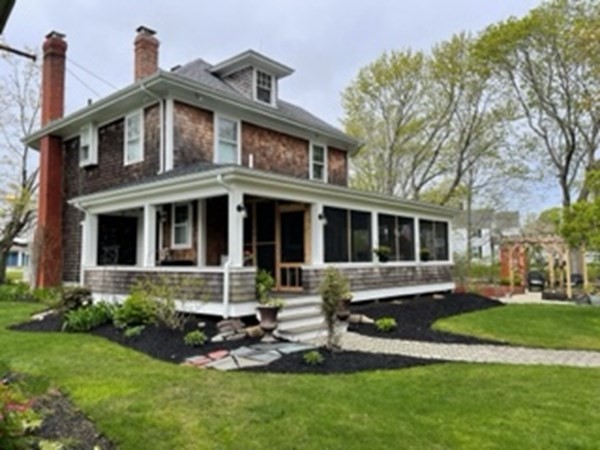 802 State Road Plymouth, MA 02360 - Photo 3 of 42 a front view of a house with a yard table and chairs