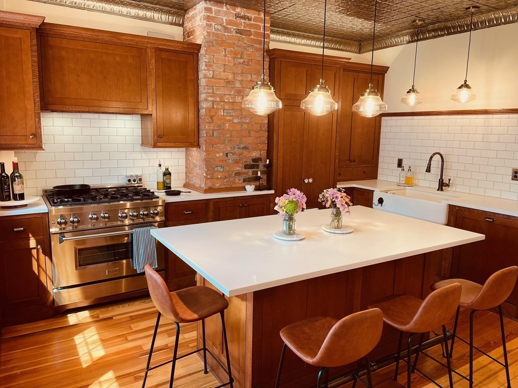 802 State Road Plymouth, MA 02360 - Photo 4 of 42 a kitchen with a table and chairs in it
