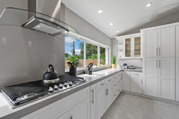 a spacious bedroom with a bed and a window