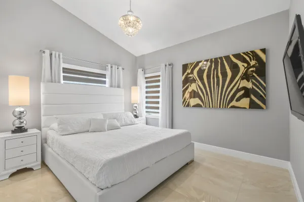 a bedroom with a bed and a cabinets