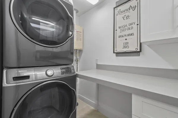 a kitchen with white cabinets and a sink