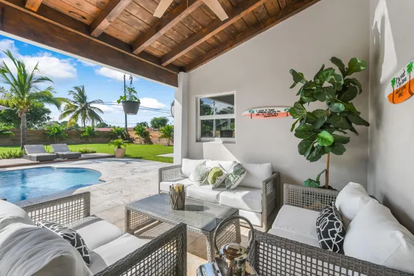 a view of swimming pool with lounge chair