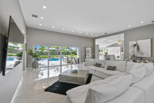 a living room with furniture and a large window