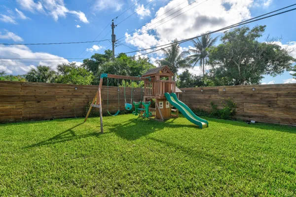 a view of a house with a big yard