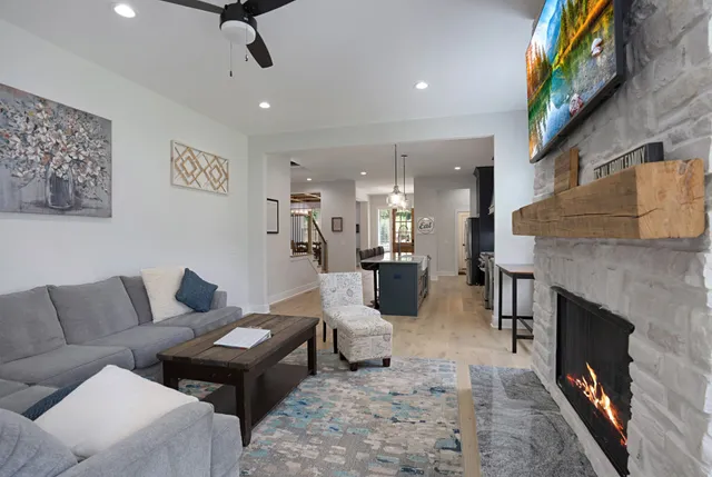a living room with furniture and a fireplace
