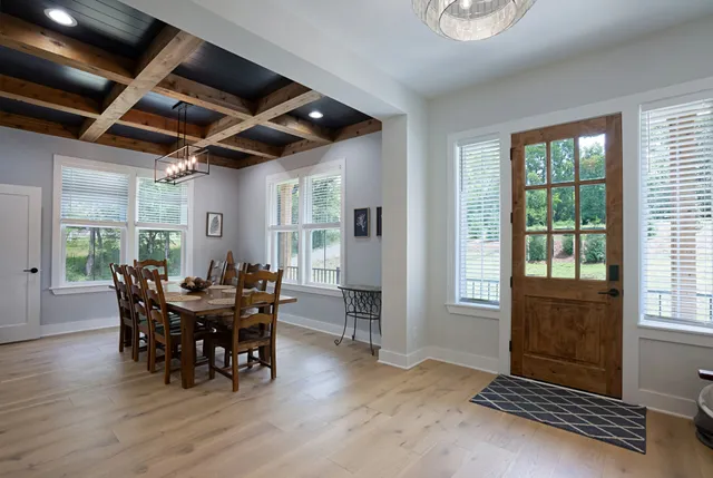 a view of a dining room with furniture window and outside view