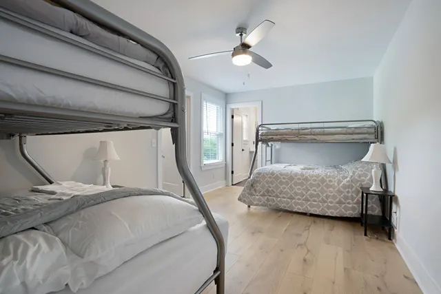 a bedroom with a bed and lamp