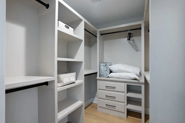 a room with a furniture and a ceiling fan