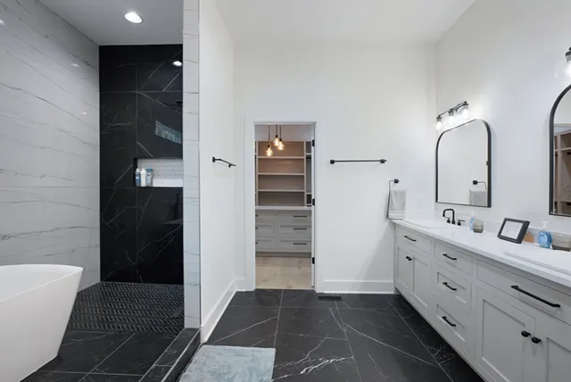 a bathroom with a bathtub and shower